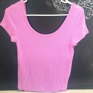 Simple purple t shirt, the back scoops lower than the front a little.